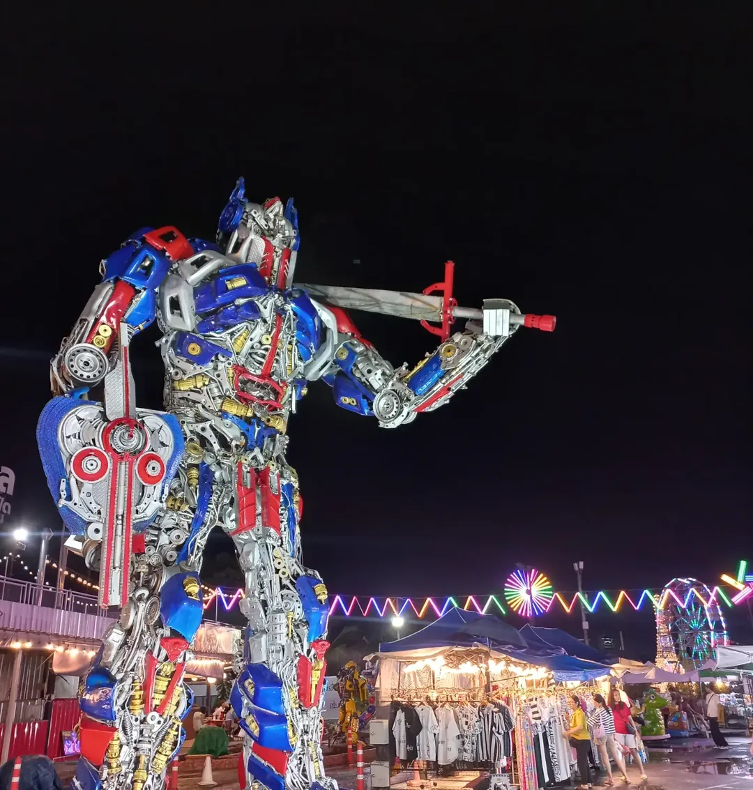 Liab Duan Night Market in Bangkok with giant robot display and colorful night lights